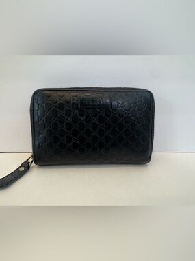 Gucci Black GG Embossed Zip Around Wallet - Leather